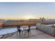 Private rooftop deck offers a relaxing space and panoramic city views at sunset at 1499 Blake St # 6K, Denver, CO 80202