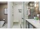 Modern shower featuring white tile, a sleek glass door, and contemporary fixtures at 1499 Blake St # 6K, Denver, CO 80202