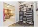 Spacious walk-in closet featuring ample shelving and storage, with a glimpse into the luxurious bathroom at 1499 Blake St # 6K, Denver, CO 80202