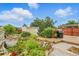Landscaped backyard with lush garden, patio deck, and outdoor grill for relaxing and entertaining at 4716 Broadway, Denver, CO 80216