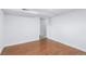 Spacious basement area with wood plank flooring and freshly painted walls at 4716 Broadway, Denver, CO 80216