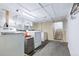 Unfinished basement laundry area with washer, dryer, and ample space for storage at 4716 Broadway, Denver, CO 80216