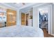 Bedroom with hardwood floors, closet access, and views to the kitchen at 4716 Broadway, Denver, CO 80216