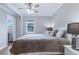 Bright bedroom featuring hardwood floors, neutral paint, and generous natural light at 4716 Broadway, Denver, CO 80216