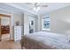 Bedroom with hardwood floors, closet access, and views to the exterior at 4716 Broadway, Denver, CO 80216