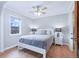 Bedroom with hardwood floors, ceiling fan, neutral paint, and ample natural light at 4716 Broadway, Denver, CO 80216