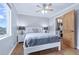 Updated bedroom with hardwood floors, neutral paint, natural light, and closet access at 4716 Broadway, Denver, CO 80216
