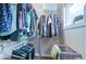 Walk-in closet with shelving, hanging racks, and natural light at 4716 Broadway, Denver, CO 80216