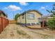 Exterior of home with small patio and table with chairs, perfect for enjoying the outdoors at 4716 Broadway, Denver, CO 80216