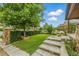 Landscaped front yard featuring a stone pillar mailbox and terraced stone steps at 4716 Broadway, Denver, CO 80216