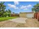View of detached garage with gravel area and partial lawn, adding functionality to the property at 4716 Broadway, Denver, CO 80216