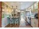 Bright kitchen featuring granite countertops, stainless steel appliances, a stylish island, and a unique wallpaper accent at 4716 Broadway, Denver, CO 80216