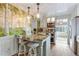 Well-appointed kitchen with granite countertops, stainless steel appliances, a stylish island with seating, and hardwood floors at 4716 Broadway, Denver, CO 80216