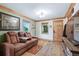 Inviting living room with hardwood floors, comfortable seating, and well-lit windows providing ample natural light at 4716 Broadway, Denver, CO 80216