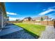 Spacious backyard with a concrete patio area perfect for outdoor dining and entertaining at 56459 E 23Rd Pl, Strasburg, CO 80136