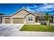 Charming single-story home featuring a spacious two car garage and well-manicured front lawn at 56459 E 23Rd Pl, Strasburg, CO 80136