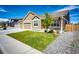 Charming home featuring well-manicured lawn and a quaint front porch area perfect for enjoying the outdoors at 56459 E 23Rd Pl, Strasburg, CO 80136