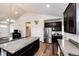 Stylish kitchen with large island and stainless steel appliances at 56459 E 23Rd Pl, Strasburg, CO 80136