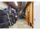 Unfinished basement space ideal for storage, featuring exposed ceiling, concrete floor and a variety of items stored at 3280 S Ouray Way, Aurora, CO 80013