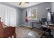 Spare bedroom features a well-lit desk/work area with a window view at 3280 S Ouray Way, Aurora, CO 80013