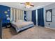 Cozy bedroom with a comfortable bed, accent wall, and soft lighting at 3280 S Ouray Way, Aurora, CO 80013