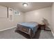 Cozy bedroom featuring neutral walls, carpet, and a side table with lamp providing a calm atmosphere at 3280 S Ouray Way, Aurora, CO 80013