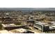 Expansive aerial view showcases the cityscape with mountains in the background at 1133 14Th St # 1850, Denver, CO 80202