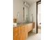 Bathroom featuring a floating vanity with marble top and modern lighting fixtures at 1133 14Th St # 1850, Denver, CO 80202