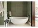 Stylish bathroom features a modern white soaking tub with sleek fixtures and a minimalist design at 1133 14Th St # 1850, Denver, CO 80202