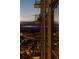 Exterior view showing a building with glass balconies and city lights at dusk at 1133 14Th St # 1850, Denver, CO 80202