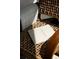 A close up of a book and blanket on a woven chair at 1133 14Th St # 1850, Denver, CO 80202
