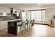 Modern kitchen with sleek island, stainless steel appliances, and a large window with city views at 1133 14Th St # 1850, Denver, CO 80202
