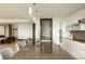 Spacious kitchen island featuring a sink and chairs, complemented by modern cabinets and appliances at 1133 14Th St # 1850, Denver, CO 80202
