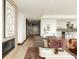A luxurious living space flows into a kitchen and features stylish seating and modern fireplace at 1133 14Th St # 1850, Denver, CO 80202