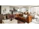 Open-concept living room featuring modern furnishings, a view of the kitchen and dining area at 1133 14Th St # 1850, Denver, CO 80202