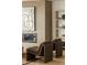 Living room featuring modern lounge chairs, an art piece, and a stylish fireplace at 1133 14Th St # 1850, Denver, CO 80202