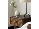 Elegant nightstand with unique detailing, complete with lamp and decorative vase at 1133 14Th St # 1850, Denver, CO 80202