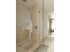Modern shower room with glass doors and beige tiles, providing a clean and luxurious feel at 1133 14Th St # 1850, Denver, CO 80202
