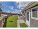 This backyard features artificial turf and a cozy patio at 3604 Collins St, Castle Rock, CO 80108