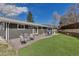 Spacious backyard featuring artificial turf and a patio seating area at 3604 Collins St, Castle Rock, CO 80108