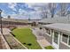 Expansive backyard featuring artificial turf, a patio area, and a storage shed with mountain views at 3604 Collins St, Castle Rock, CO 80108