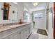 Elegant bathroom featuring double sinks, granite countertops, and a stylish vanity for a spa-like experience at 3604 Collins St, Castle Rock, CO 80108
