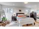 Bright bedroom with wood floors, large windows, stylish decor, and ample natural light creates a peaceful retreat at 3604 Collins St, Castle Rock, CO 80108