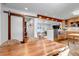 Open dining area with a large wooden table, adjacent to the kitchen and living room at 3604 Collins St, Castle Rock, CO 80108