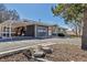 Exterior view of this charming home featuring a covered carport and well-maintained landscaping at 3604 Collins St, Castle Rock, CO 80108