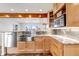 Well-lit kitchen showcasing stainless steel appliances, granite countertops, and abundant storage at 3604 Collins St, Castle Rock, CO 80108