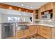 Open-concept kitchen featuring stainless steel appliances, granite counters, and stylish cabinetry at 3604 Collins St, Castle Rock, CO 80108