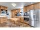 Well-equipped kitchen boasting stainless steel appliances, stylish cabinets, and a tiled backsplash at 3604 Collins St, Castle Rock, CO 80108