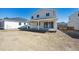 Home's backyard featuring a covered patio, and space for landscaping and outdoor enjoyment at 1311 Rock Cliff Ave, Erie, CO 80516