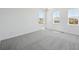 Neutral bedroom featuring gray carpeting, bright natural light and white walls at 1311 Rock Cliff Ave, Erie, CO 80516